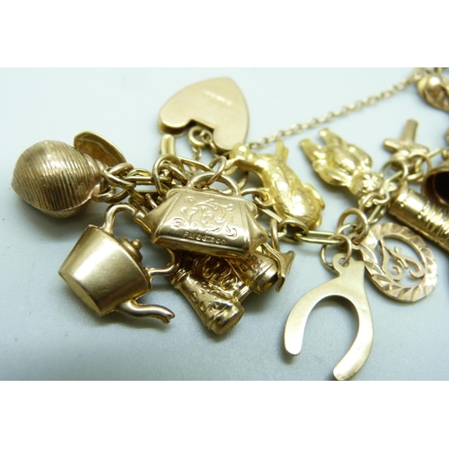 982 - A 9ct gold charm bracelet, 25.2g