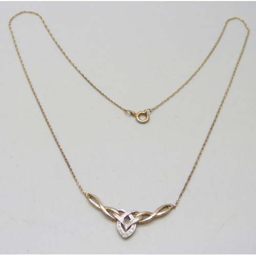 983 - A 9ct gold and diamond Celtic style necklace, 2.4g