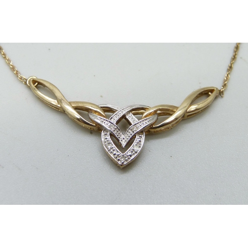 983 - A 9ct gold and diamond Celtic style necklace, 2.4g