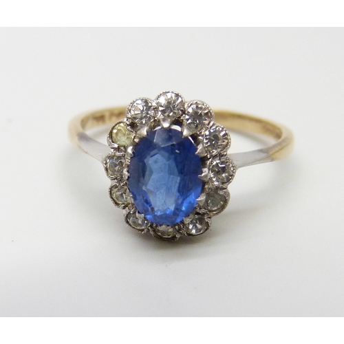 988 - A 9ct gold and silver ring, set with a blue and white stones, M, 2.5g