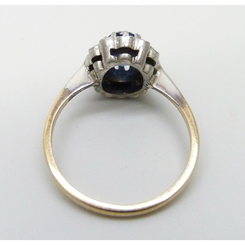 988 - A 9ct gold and silver ring, set with a blue and white stones, M, 2.5g