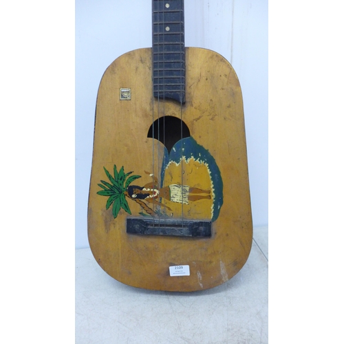 2109 - An Aria Pro II Magna series left handed bass guitar and a Hawaiian style acoustic guitar