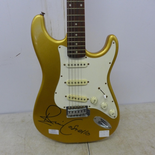 2113 - An Austin gold body electric guitar - bears signature of Elvis Costello