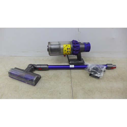 2114 - A Dyson V10 cordless stick vacuum cleaner with charger