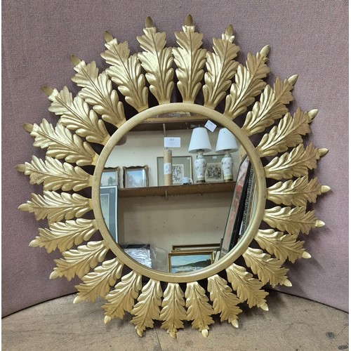 367 - A large gilt framed leaf mirror