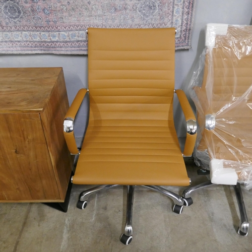 1350 - A tan and chrome Eames style desk chair