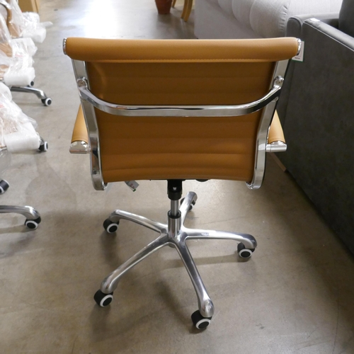 1350 - A tan and chrome Eames style desk chair