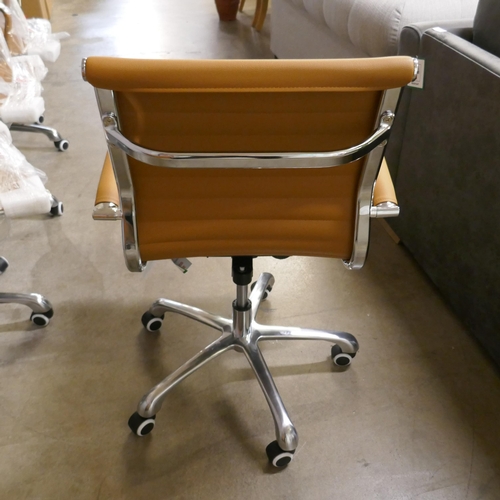 1351 - A tan and chrome Eames style desk chair