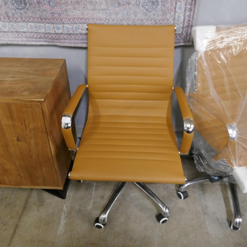 1352 - A tan and chrome Eames style desk chair