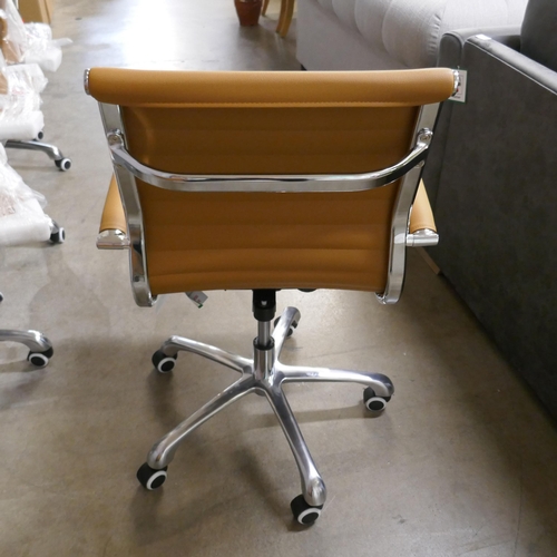 1352 - A tan and chrome Eames style desk chair