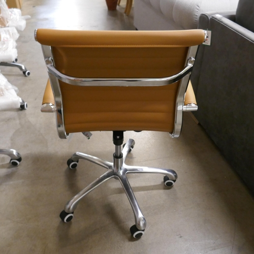 1353 - A tan and chrome Eames style desk chair