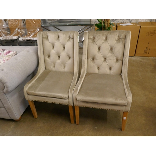 1369 - A pair of mink buttoned dining chairs *This lot is subject to VAT