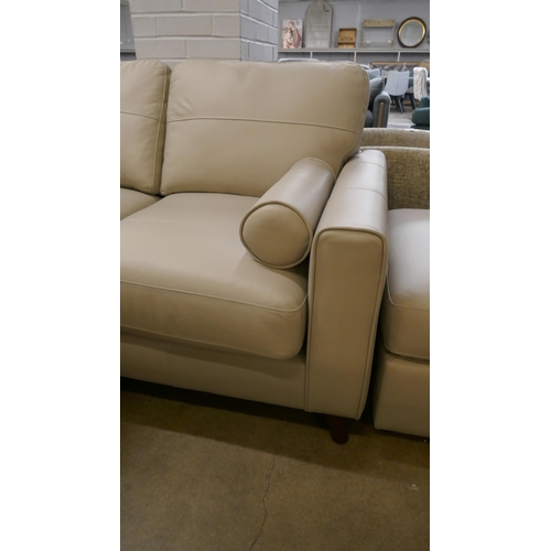 1379 - A stone leather corner sofa and footstool