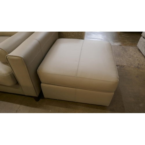 1379 - A stone leather corner sofa and footstool