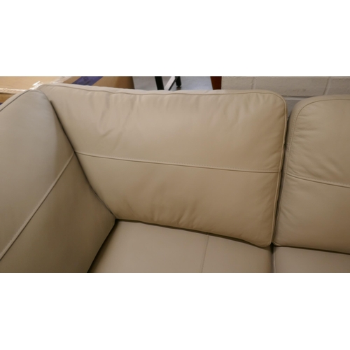 1379 - A stone leather corner sofa and footstool