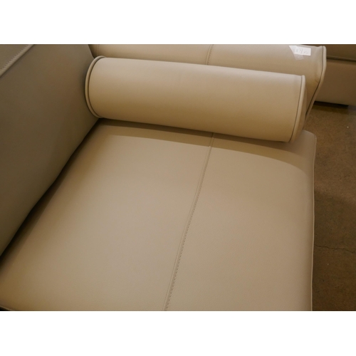 1380 - A stone leather two seater sofa