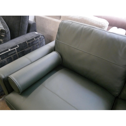 1414 - A green leather three seater sofa