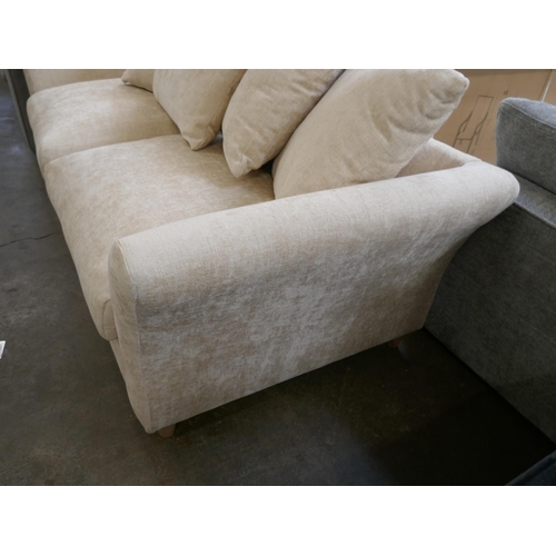 1422 - An oatmeal velvet three seater sofa