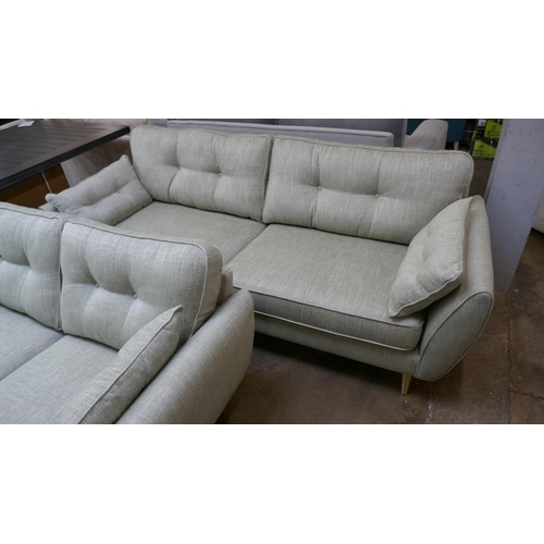 1433 - An olive fleck four seater sofa and 2.5 seater sofa