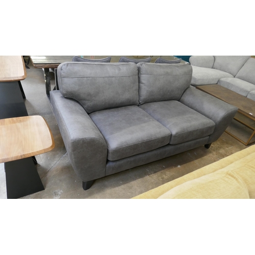 1441 - A charcoal PU leather three seater sofa