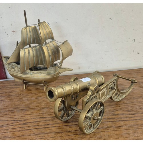 355 - A brass cannon and model of a tall masted ship