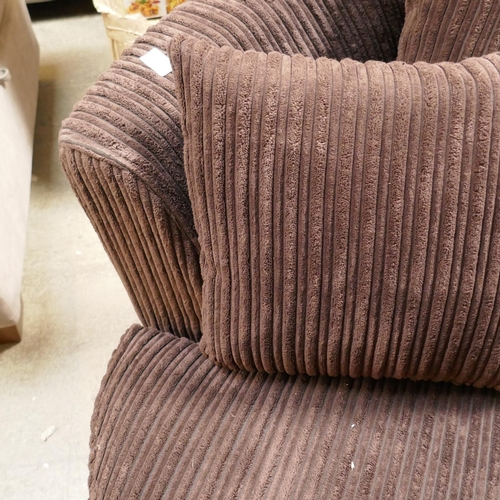 1483 - A brown cord swivel armchair