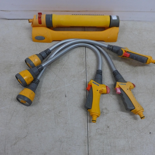 2398 - A Hozelock 2 in 1 sprinkler and 3 Hozelock hose pipe attachments