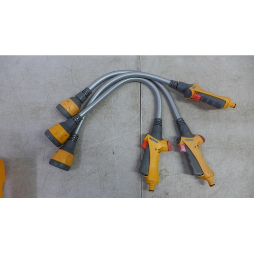 2398 - A Hozelock 2 in 1 sprinkler and 3 Hozelock hose pipe attachments