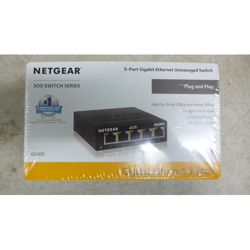 2402 - A box of assorted computing and networking items including Netgear ethernet switches