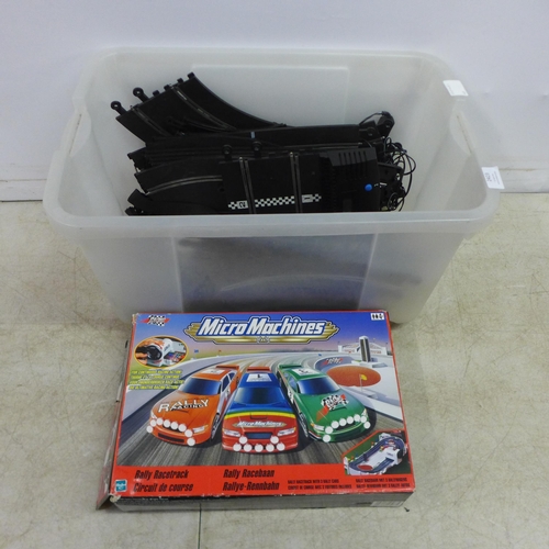 2423 - A Micro Machines Rally race track and a quantity of slot racing game equipment