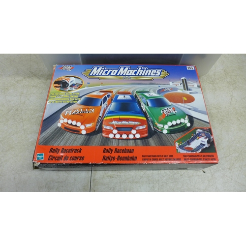 2423 - A Micro Machines Rally race track and a quantity of slot racing game equipment