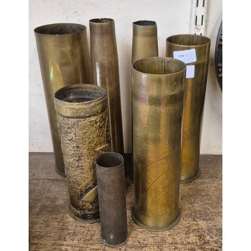 340 - Seven brass military shells including a pair of shells marked Ypres