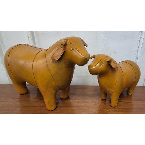 335 - A pair of Liberty & Co. butterscotch leather bull shaped footstools