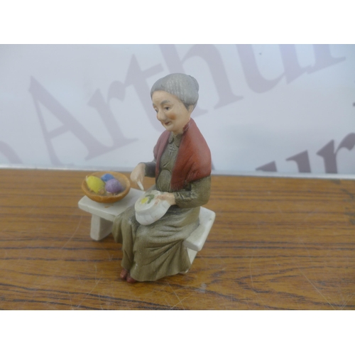 2344 - A crate of household ornaments including vases, cups, money boxes, binoculars, etc.