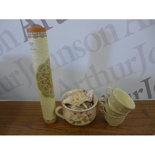 2344 - A crate of household ornaments including vases, cups, money boxes, binoculars, etc.