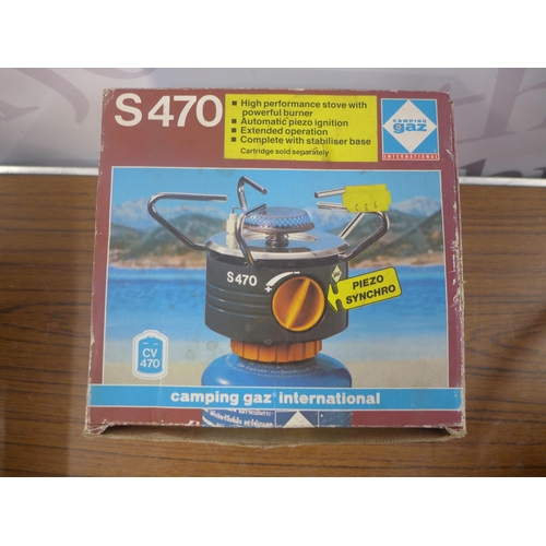 2353 - A Camping Gaz Xcelerate 3 burner camping  cooker with a  1/2 full gas bottle and a plastic crate of ... 