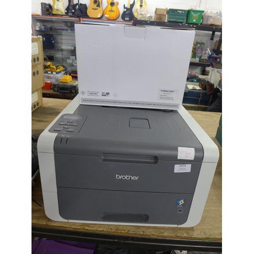 2374 - A Brother HL-31 40CW printer and a set of coloured inks cartridges