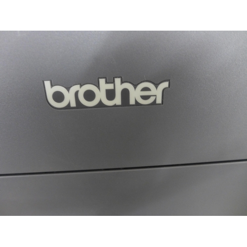 2374 - A Brother HL-31 40CW printer and a set of coloured inks cartridges