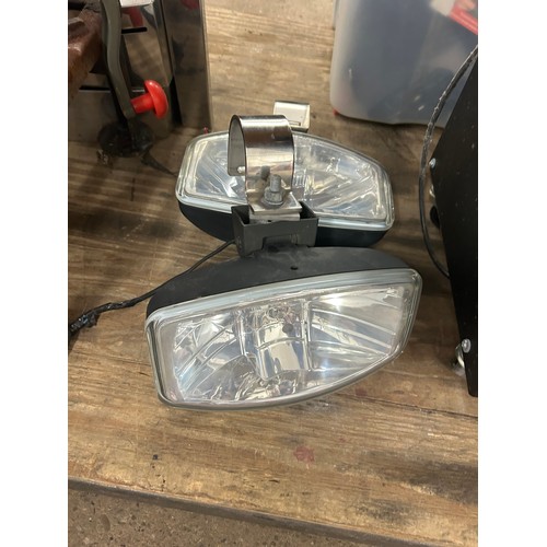 2395 - A pair of large driving lights with stainless mounting brackets with internal side lights