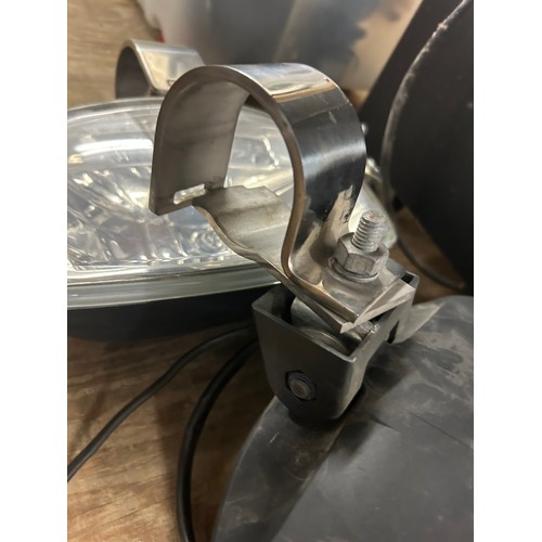 2395 - A pair of large driving lights with stainless mounting brackets with internal side lights