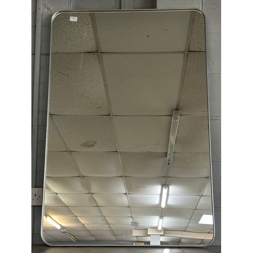 1451 - A large silver framed mirror