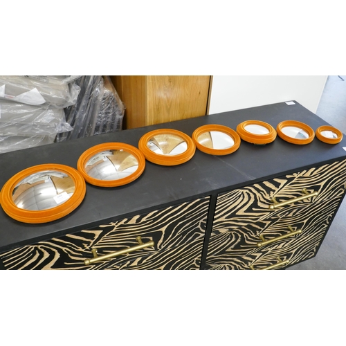 1452A - A set of six flocked convex tangerine wall mirrors