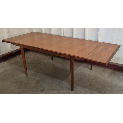 5 - A Danish teak rectangular dining table and six chairs