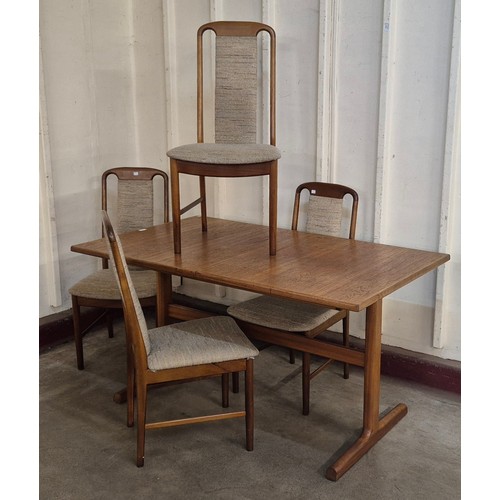 8 - A McIntosh teak rectangular extending dining table and four chairs