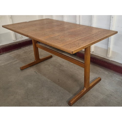 8 - A McIntosh teak rectangular extending dining table and four chairs