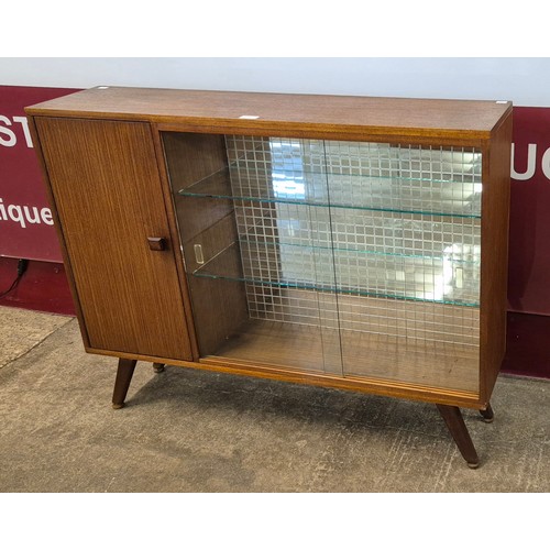 9 - A teak display cabinet