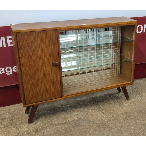 9 - A teak display cabinet