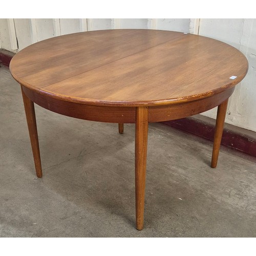 17 - A Jentique teak circular extending dining table