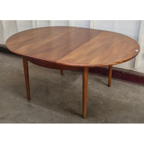 17 - A Jentique teak circular extending dining table