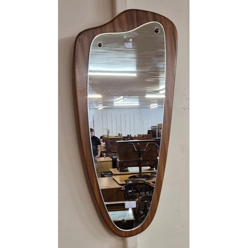 15 - A teak asymmetrical framed mirror